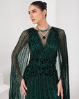 Midnight green heavily embellished gown with cape
