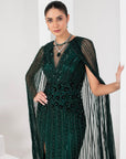 Midnight green heavily embellished gown with cape
