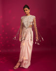 Peachy Pink Ajrakh Stripwork Jacket Paired Up With Peachy Pink Bralette And Drape Dhoti Skirt