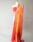 Sunset Orange Handwoven Silk Sari And Red Color Unstitched Blouse