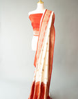 White/Red Handwoven Silk Sari And Red Color Unstitched Blouse