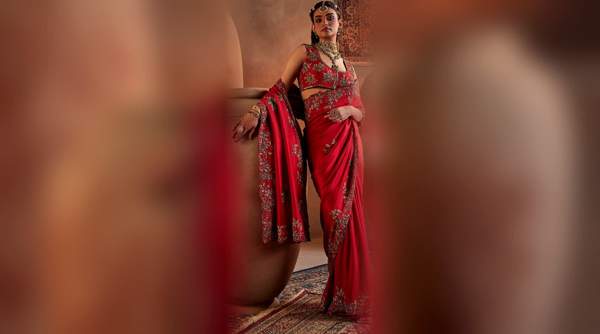Dark red hand embroidered silk saree with gold floral embroidery worn for Diwali puja — Manvi Kapoor