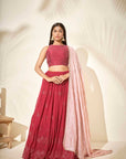 Maroon Georgette Crepe One-Shoulder Crop Top and Pleated Skirt Lehenga with Mirror and Zardosi Handwork
