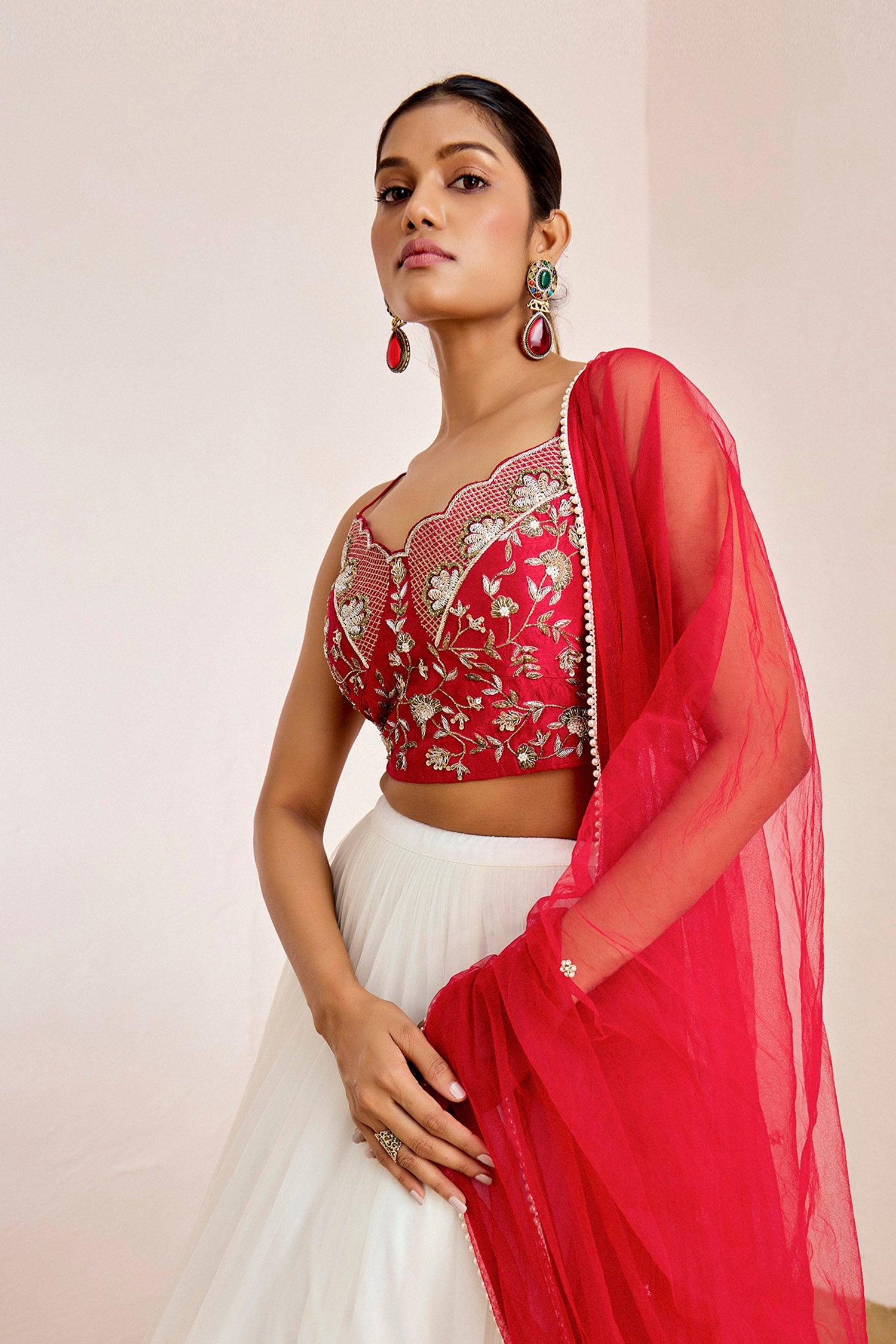 Hand Embroidered Bustier Blouse with Embellished Net Lehenga and Dupatta